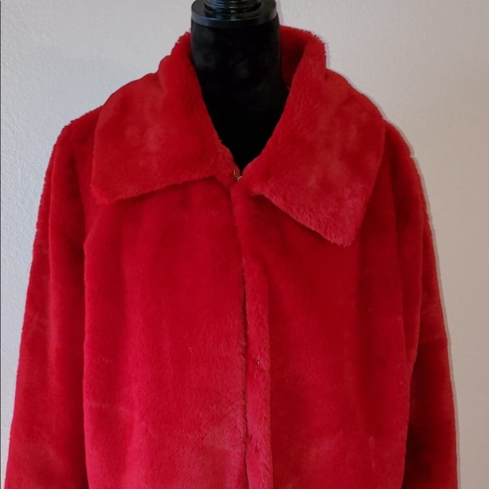 Red faux fur jacket with side pockets.